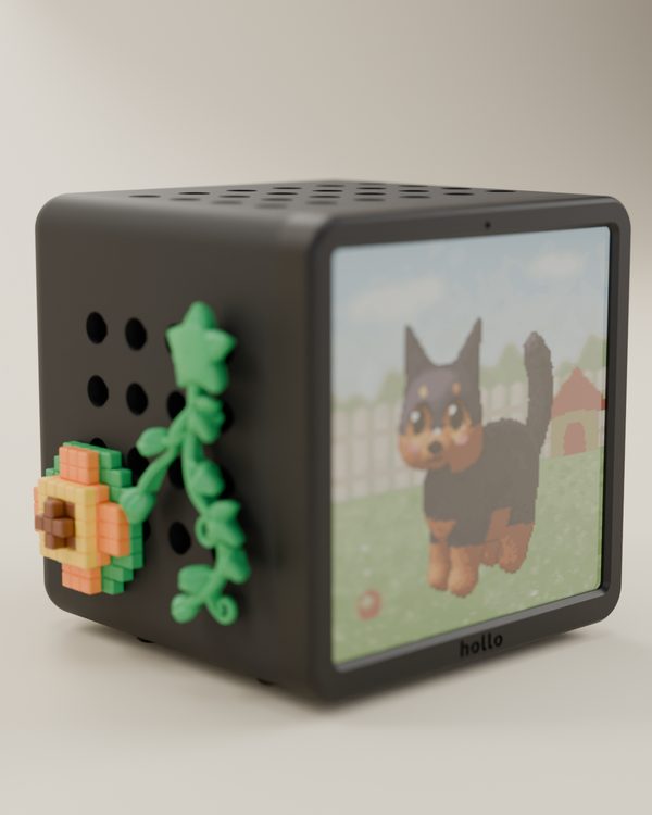 Rendered studio shot: a black Hollo with pixel vines and a pixel flower, showing a pixel dog on its screen