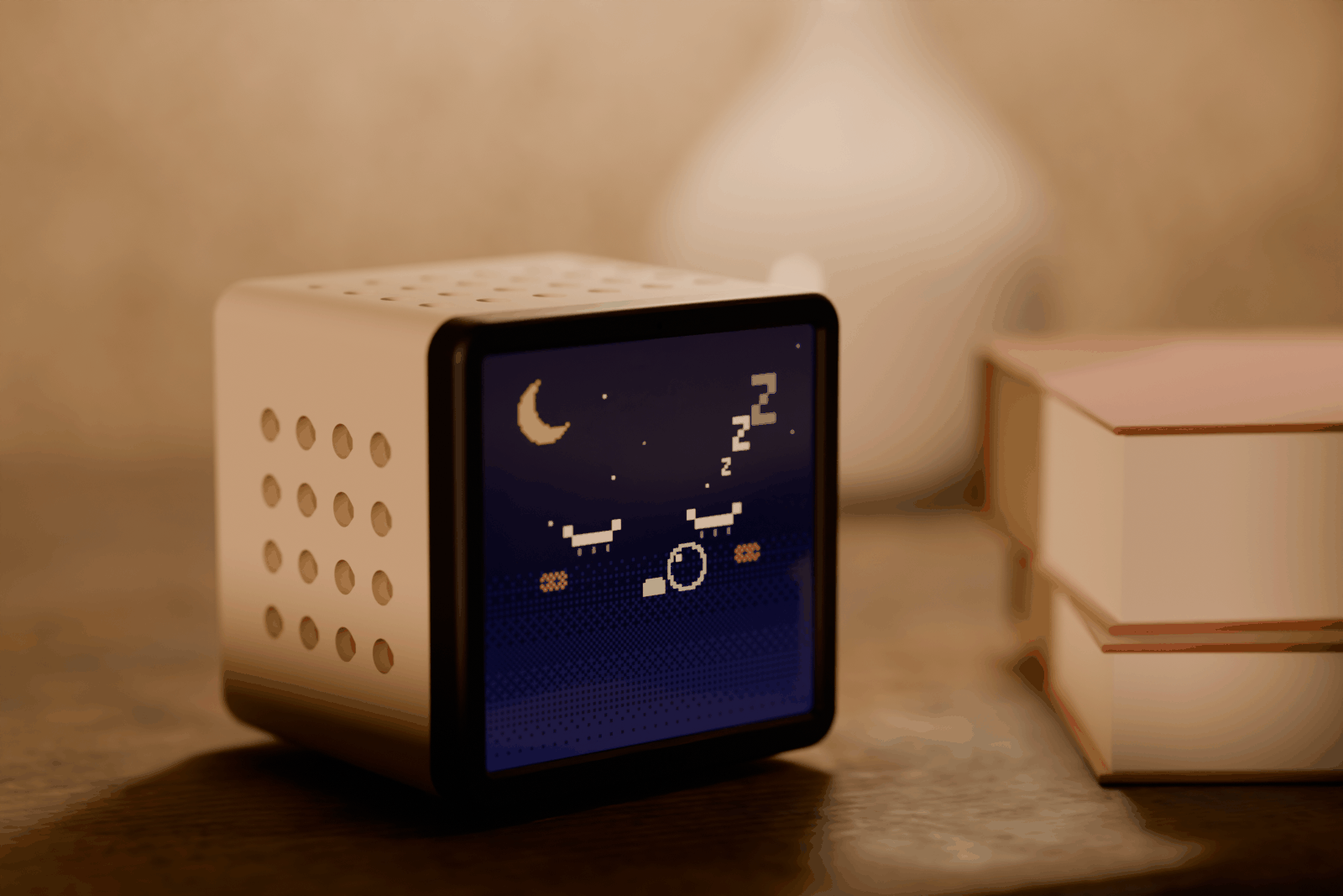 Rendered scene: a cream Hollo asleep on a bedside table at golden hour, next to a warm lamp